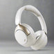 Over-ear wireless headphones in black color with a noise-cancellation feature, shown with a detachable cable and a 3.5 mm jack.