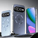 Three smartphone cases shown upright on a dark surface against a gray gradient background. The left case is light icy blue, the center case is dark blue-gray with a metallic circular MagSafe-style ring and camera cutout, and the right case is silver with a phone screen visible inside.