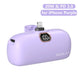 Purple power bank with digital display and charging ports on a white background
