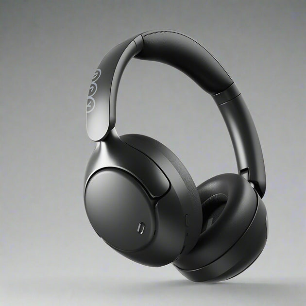 Over-ear wireless headphones in black color with a noise-cancellation feature, shown with a detachable cable and a 3.5 mm jack.